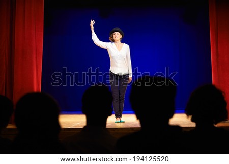 Arts and entertainment in theatre with actress on stage acting in play for audience
