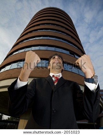 happy businessman screaming of joy out of his office