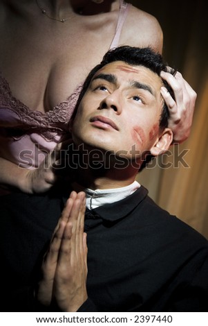 stock-photo-tempted-priest-clasping-his-hands-in-prayer-2397440.jpg