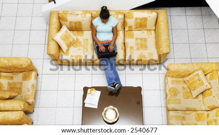 nice girl working at home and sitting on a couch