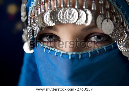 middle eastern culture: belly dancer with traditional veil