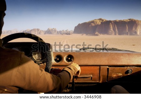 stock photo camel trophy car moving fast in the desert