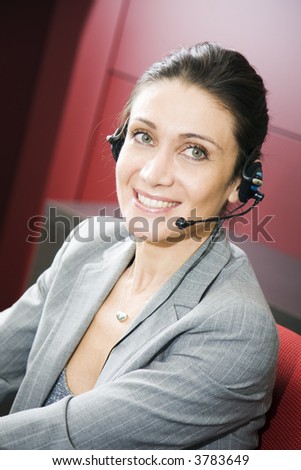 Office life: young switchboard operator representative smiling