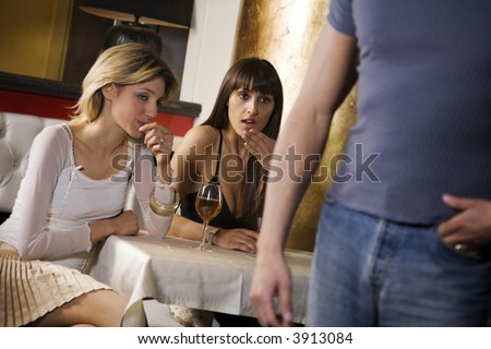 stock photo Girls night out horny girls looking at a guys backside