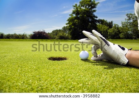 Golf club: golfer concentrating on the 18th hole