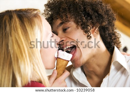 stock-photo-domestic-life-interracial-couple-sharing-an-ice-cream-10239058.jpg