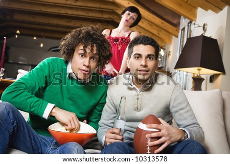 domestic life: group of friend watching a football match on tv
