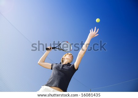 blond woman playing tennis about to hit the ball Copy space blond woman playing tennis about to hit the ball Copy space