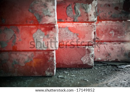piles of hot iron blocks in foundry. Narrow focus on central block