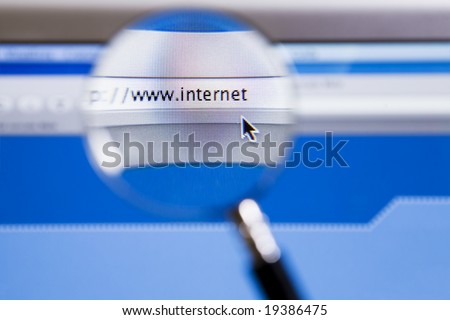 Magnifying glass on internet url of computer screen