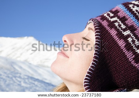 side view of young woman enjoying mountain