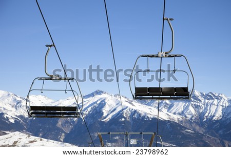 front view of chair lift moving up and down.