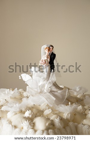 stock photo Figurines on top of wedding cake Copy space