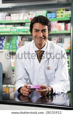 portrait of mid adult pharmacist looking at camera