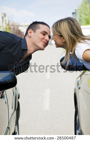 couple kissing in car. stock photo : couple leaning