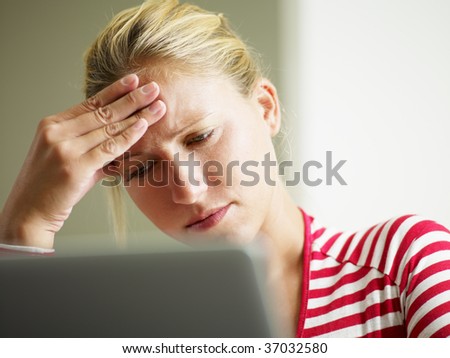 woman having headache with hands on temple. Copy space
