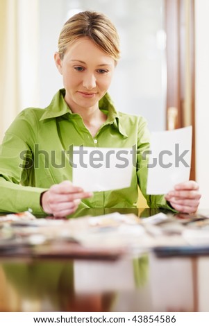 woman looking at pictures. Copy space