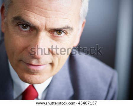 closeup of mature business man looking at camera. Copy space