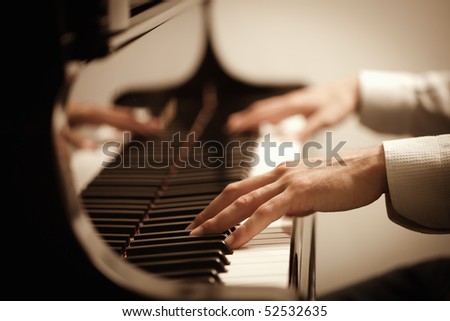 close up of male hands playing piano. Horizontal shape, copy space
