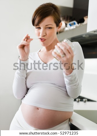 pregnant lady eating. pregnant woman eating