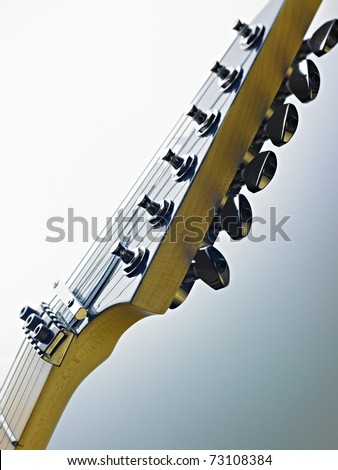 closeup of electric guitar and fretboard. Vertical shape, studio shot, selective focus