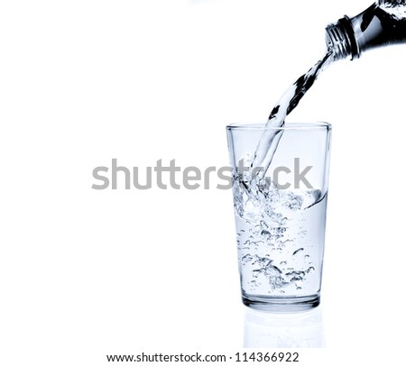 Pouring water into glass isolated on white (splash of water)