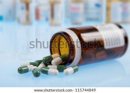 Pills in medicine bottle (pills background)