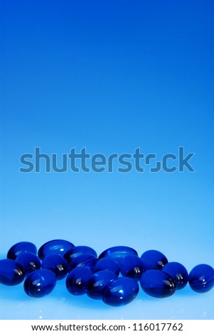 Blue pills on blue background