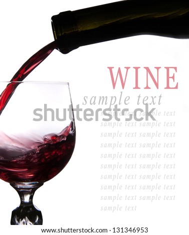 Pouring red beer into glass isolated on white background
