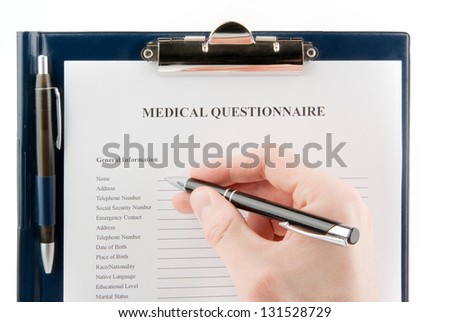 Empty medical questionnaire in a clipboard with a hand holding a pen isolated on white background