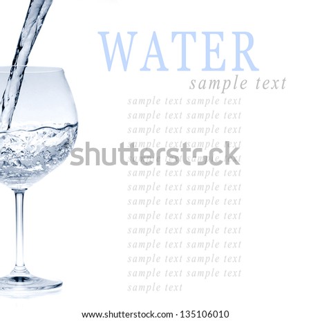 Pouring water into glass isolated on white background (water splash)