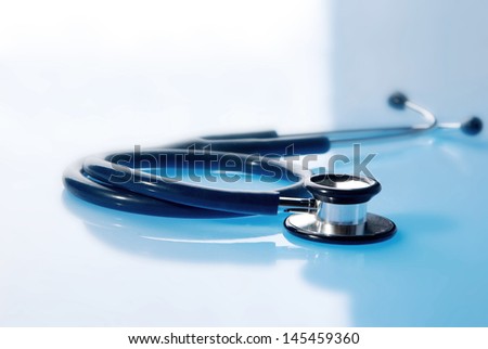 Stethoscope on blue background