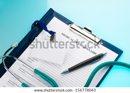 Medical questionnaire, stethoscope and empty ID tag on blue background