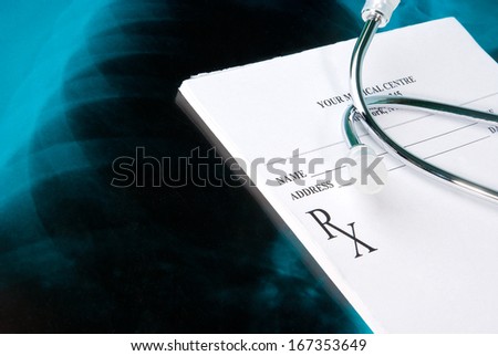 Empty medical prescription on Xray photo of lungs with stethoscope