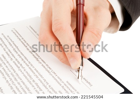 Businessman in suit signing the contract (agreement)