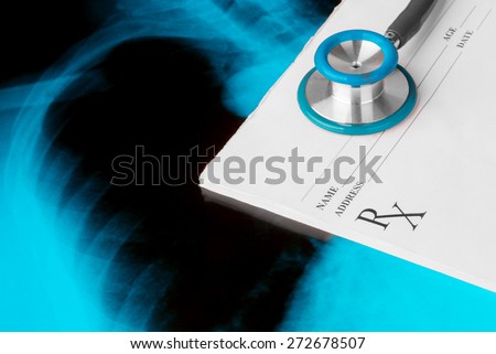 Empty medical prescription with a stethoscope on Xray photo of lungs