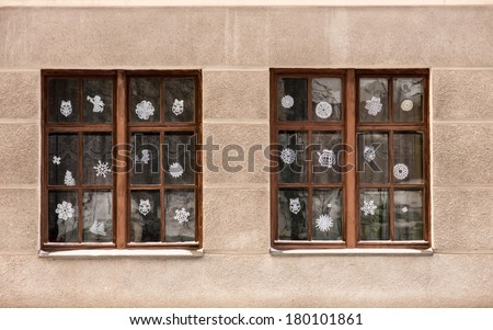 School windows decorated with paper snow flakes