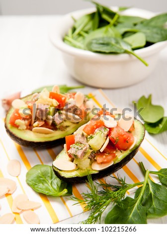 Small Appetizer Sized Paleo Salads Served in Halved Avocados