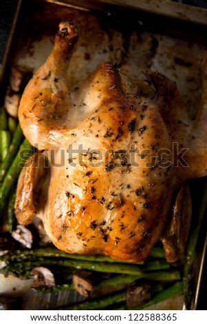 Whole Roasted Free Range Chicken Served wit Asparagus and Mushrooms