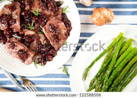 Thin Cut Pork Chops Cooked with Grapes and in Red Wine Sauce