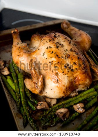 Whole Roasted Free Range Chicken Served wit Asparagus and Mushrooms