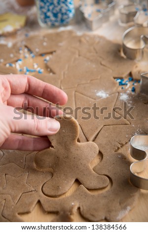Hand Picking Out Ginger Bread Man Cookie and Star