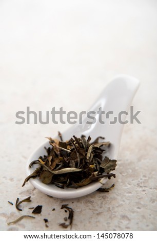 Organic White Loose Leaf Tea in Small Ceramic Spoon