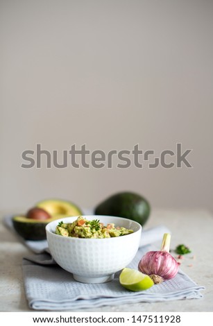 Rustic Look of Avocado and Tomatoes Dip with Fresh Pink Garlic
