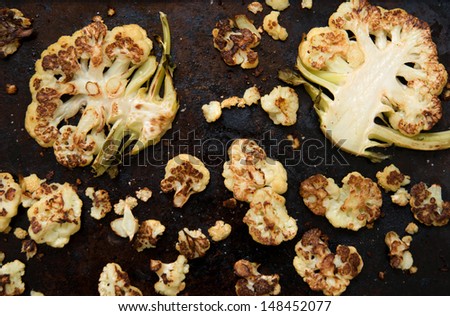 Rustic Look of Cauliflower Cut and Baked on Old Cookie Sheet with Butter, Salt, and Spices