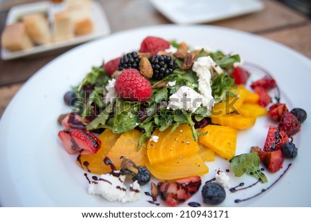 Fresh Seasonal Berries and Arugula Salad Served with Fresh Goat Cheese and Golden Beets