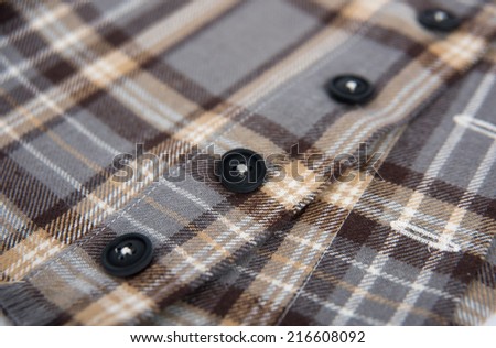 Close up of Black and Brown Plaid Flannel Shirt