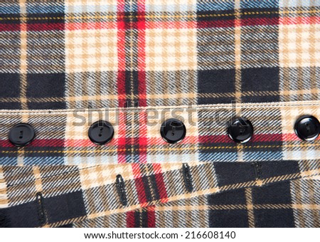 Close up of Beige,Red, Black, and Brown Plaid Flannel Shirt