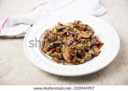Mushroom Ragout Cooked with Wine, Heavy Cream, Bacon, and Fresh Herbs