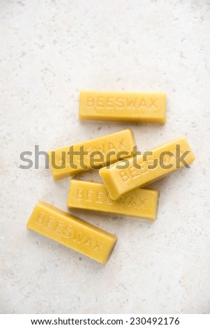 Yellow Beeswax Bars on Marble Counter Top